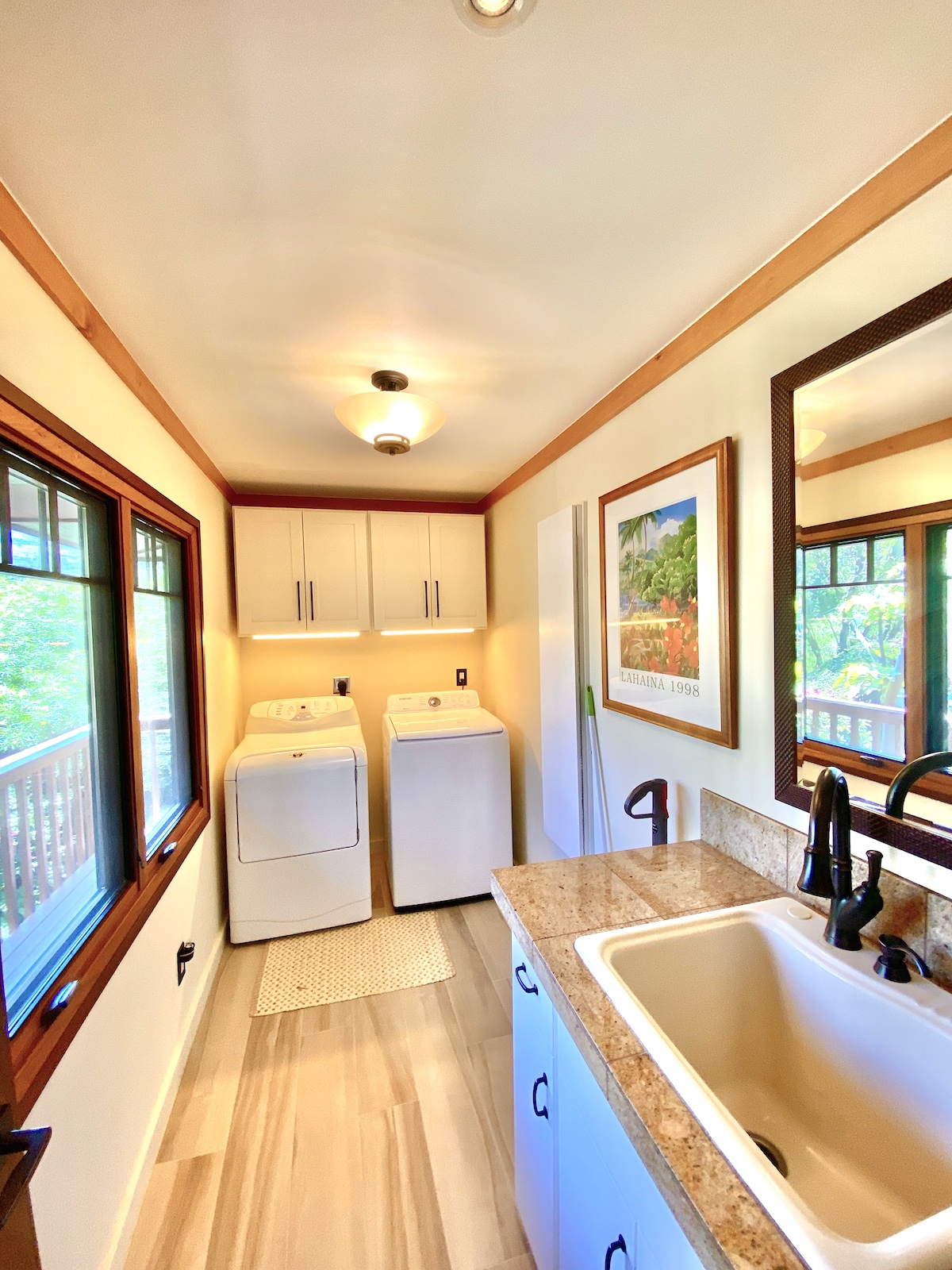 The laundry room with full sink and in-wall ironing board.